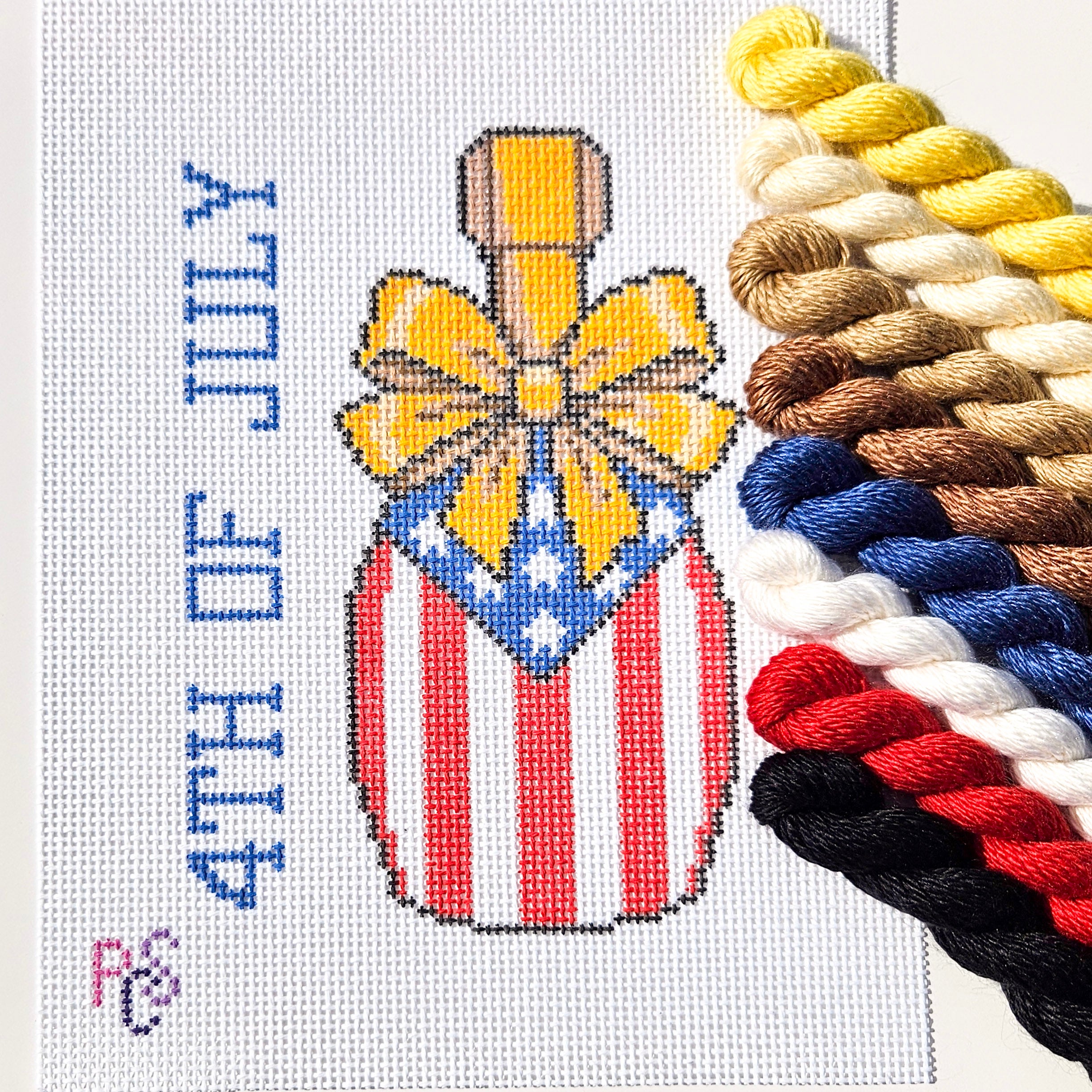 hand-painted 4th of July celebration needlepoint canvas featuring patriotic red white and blue Americana design on 13 Count Zweigart Mono Deluxe Canvas Silk and vory