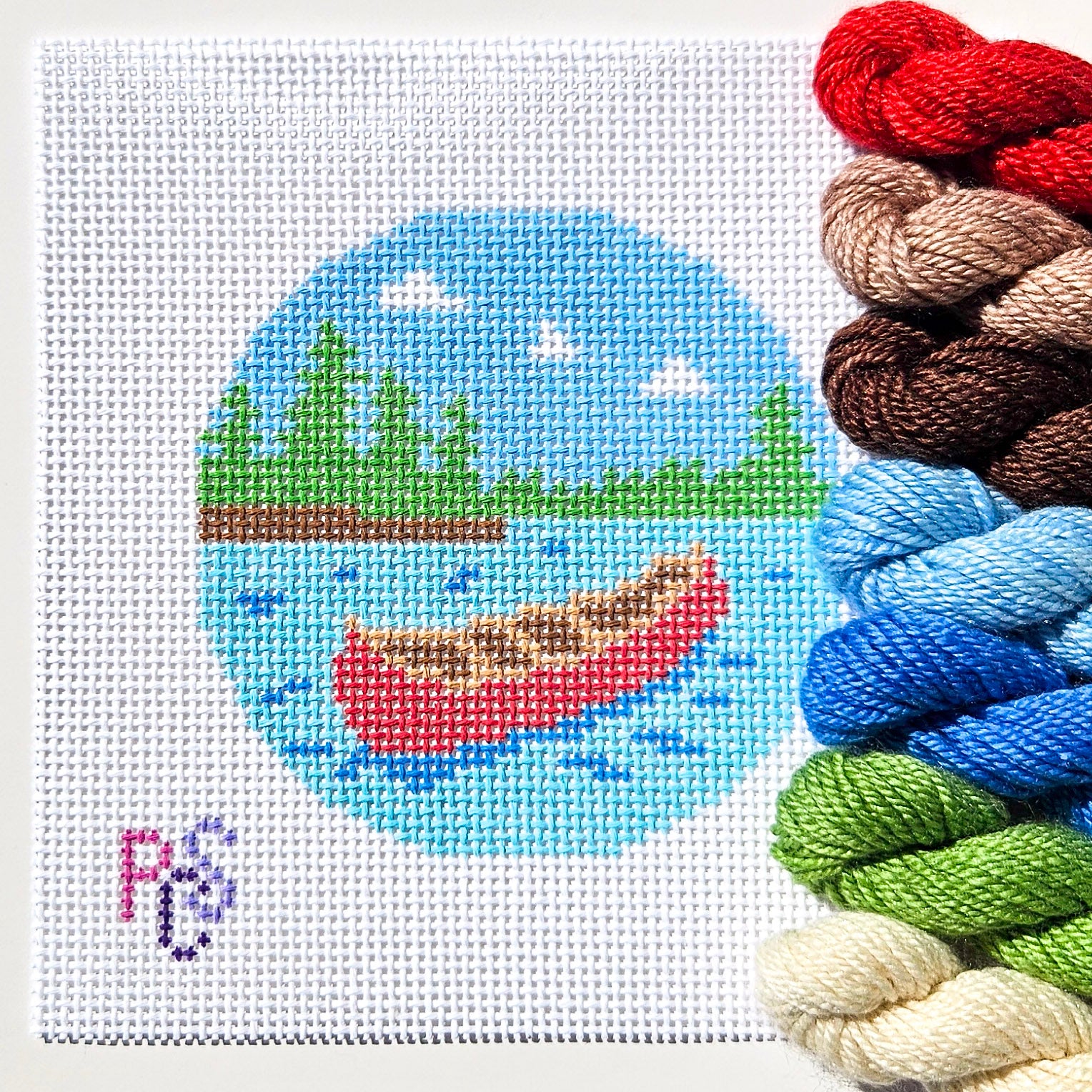Canadian cottage needlepoint canvas with a classic red canoe, blue lake and evergreen forest on 13 mesh canvas kitted with Dinky Dyes