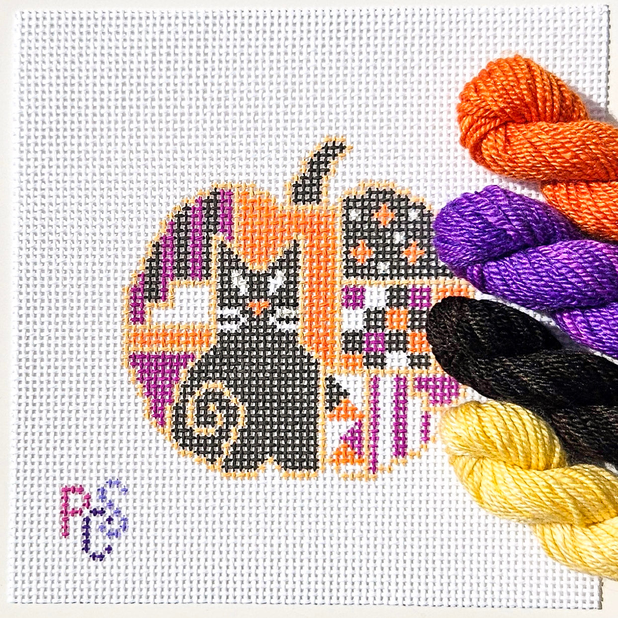 Hand-painted Halloween Pumpkin Black Cat needlepoint canvas designed for finishing as a Halloween ornament kitted with Dinky Dyes
