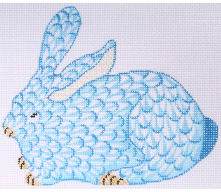 Cross-stitched blue bunny on a light blue background