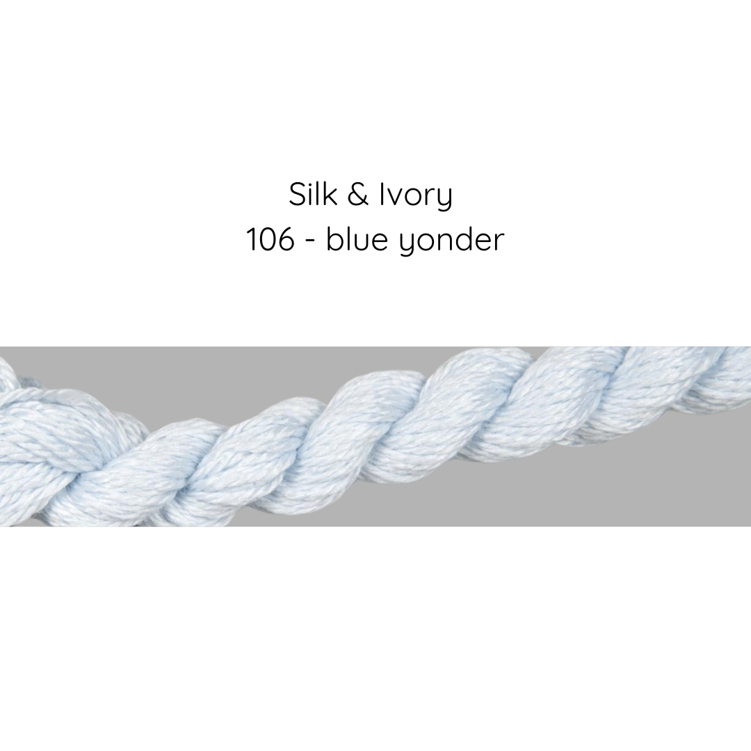 Close-up of a blue and white rope with text 'Silk & Ivory 106 - blue yonder' on a gray background.