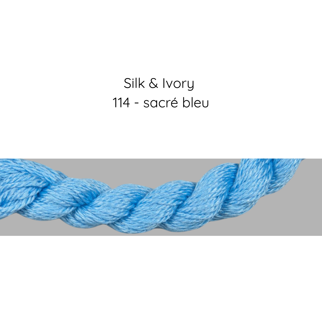 Close-up of blue silk thread with 'Silk & Ivory' and color code '114 - sacré bleu' text.