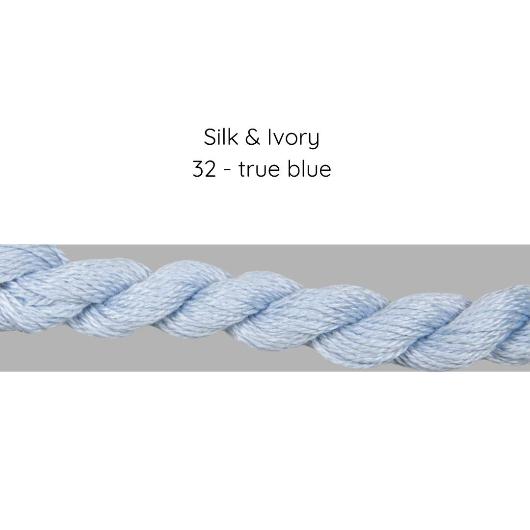 True blue thread with label 'Silk & Ivory 32 - true blue' on a gray background
