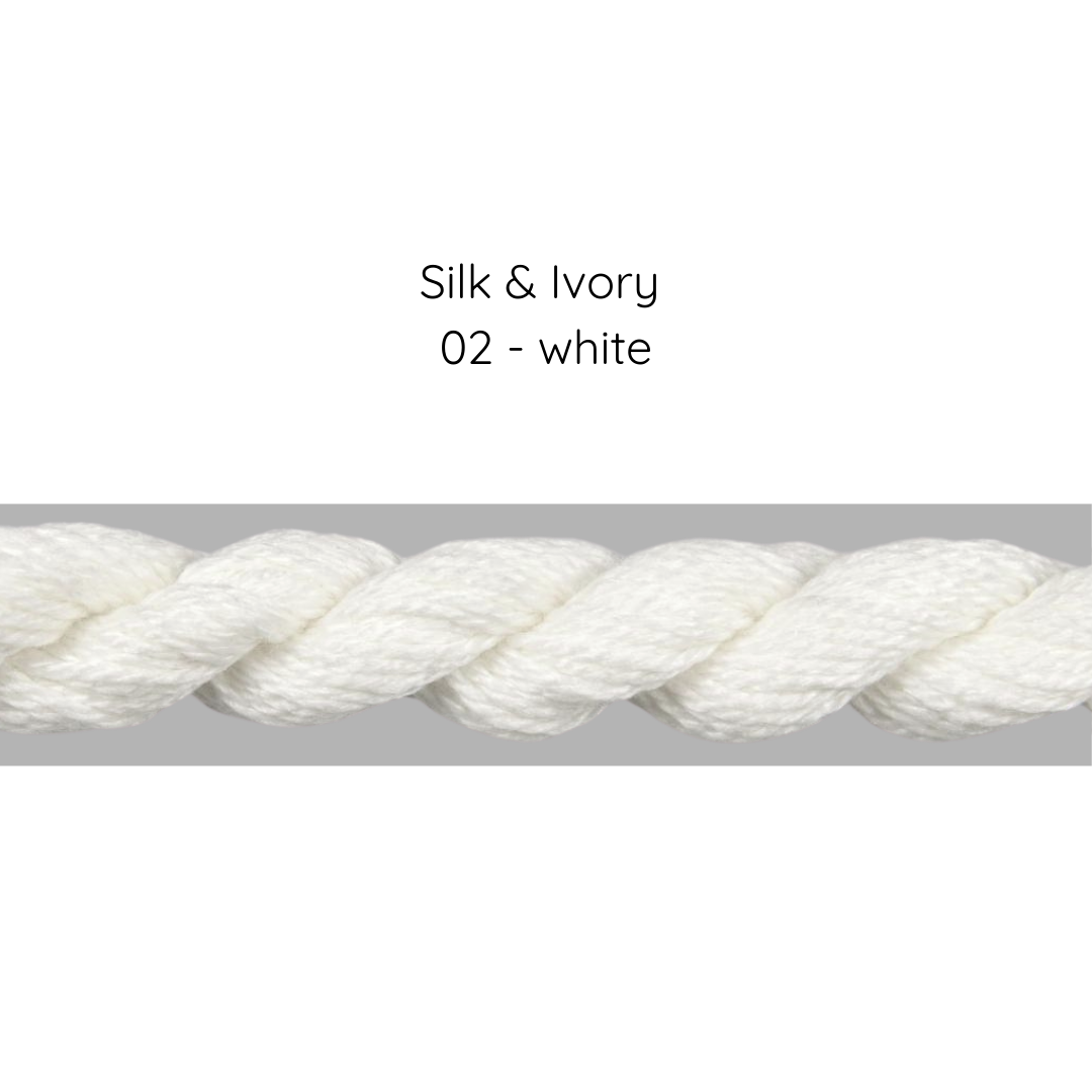 Close-up of white silk thread labeled 'Silk & Ivory 02 - white' on a gray background