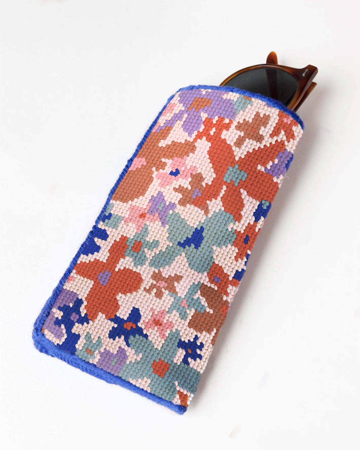 Floral patterned glasses case on a white background