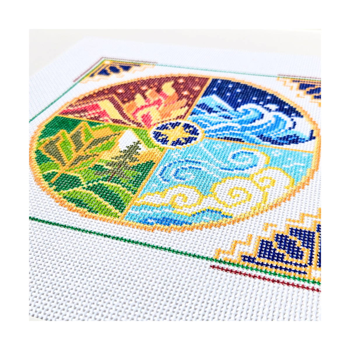 Hand-painted The Four Elements Needlepoint Kit on 13 Count Zweigart Mono Deluxe Canvas featuring symbolic fire, water, earth, and air arranged in a colorful circular geometric design details