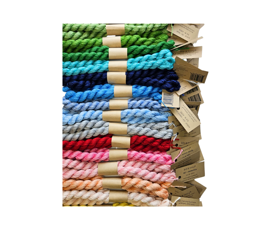 Colorful ropes in various shades with tags on a white background