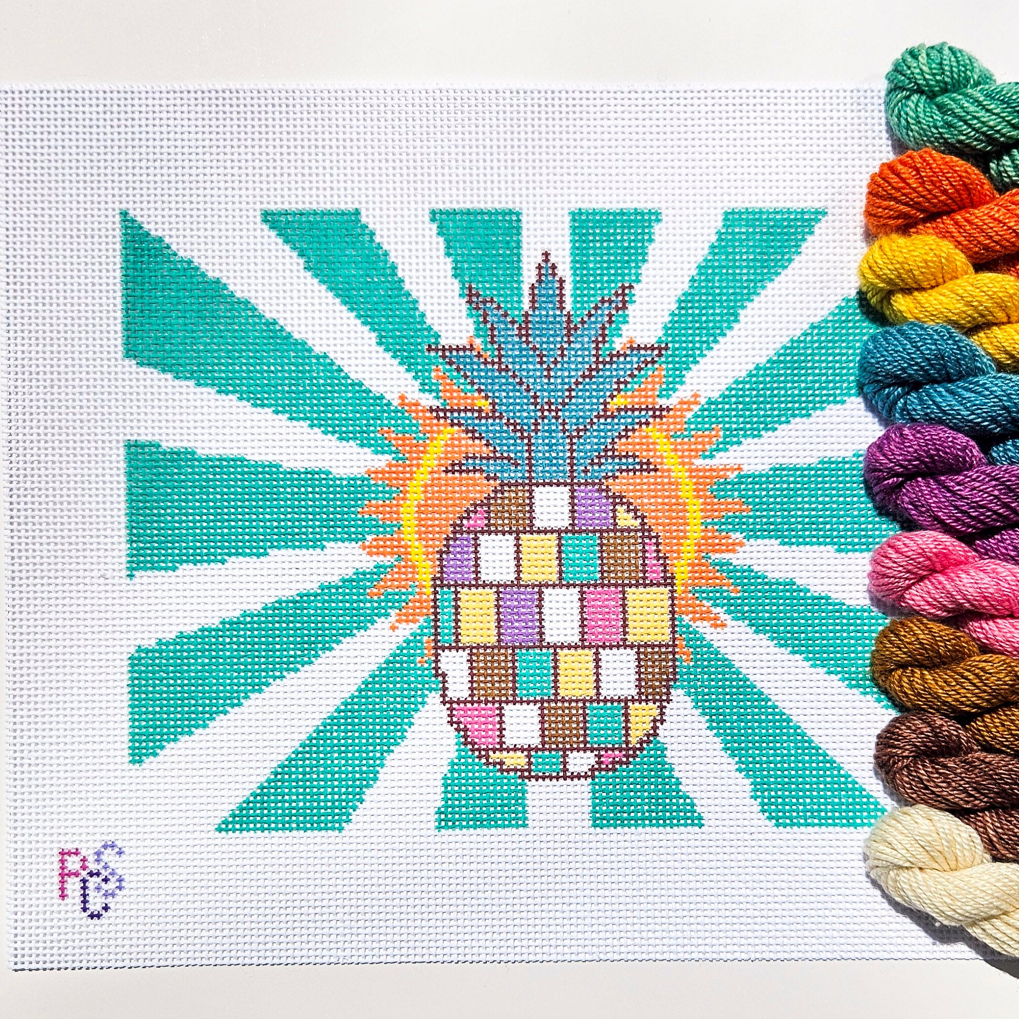 Hand-painted Disco Pineapple needlepoint canvas featuring colorful pastel blocks and turquoise sunburst rays on 13 Count Zweigart Mono Deluxe Canvas Dinky Dyes