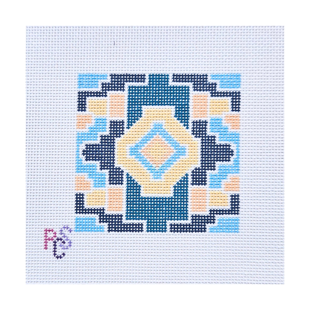 Geometric Mosaic hand-painted needlepoint canvas featuring a symmetrical teal, navy, blue, peach and gold geometric pattern