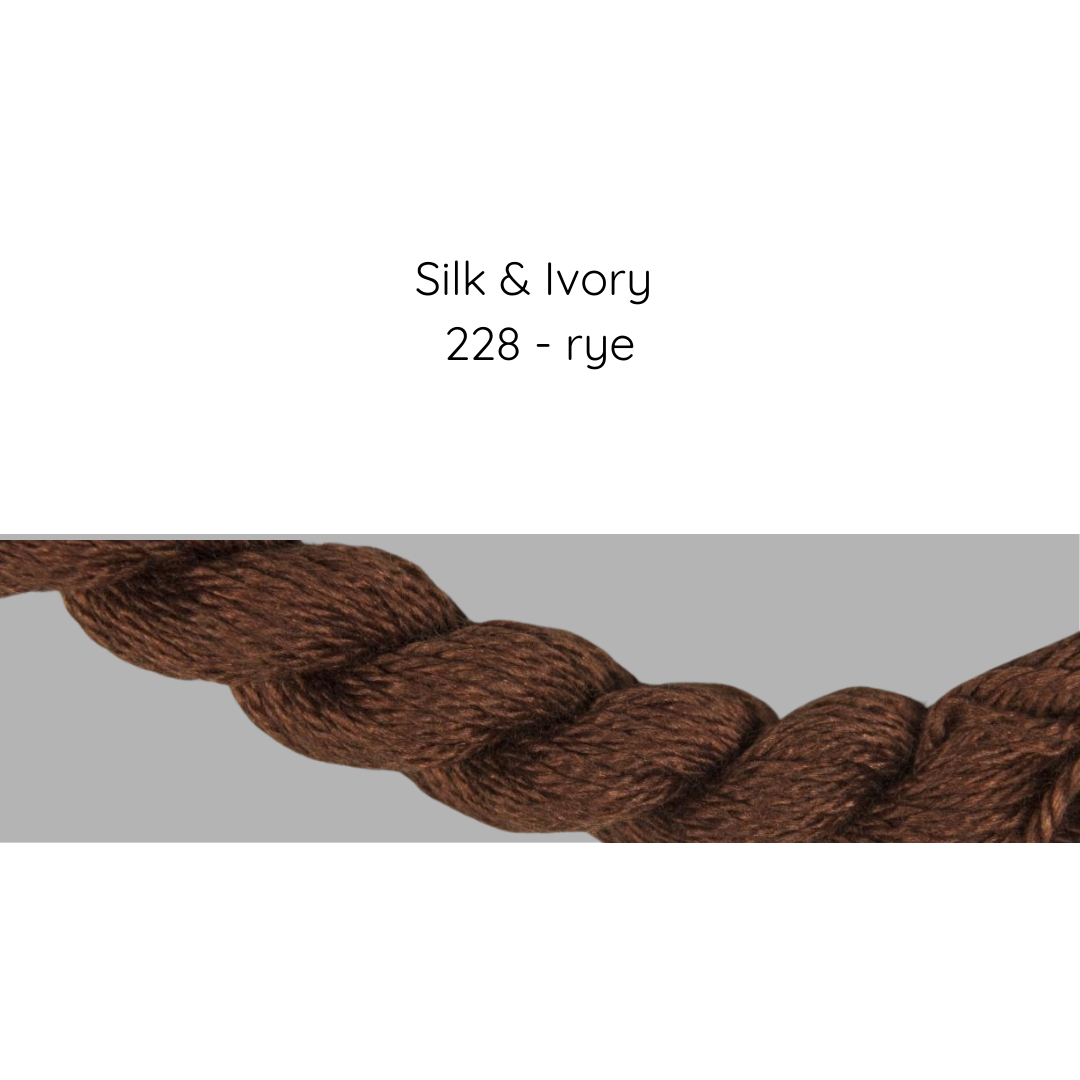 Brown yarn sample with 'Silk & Ivory 228 - rye' text on a gray background