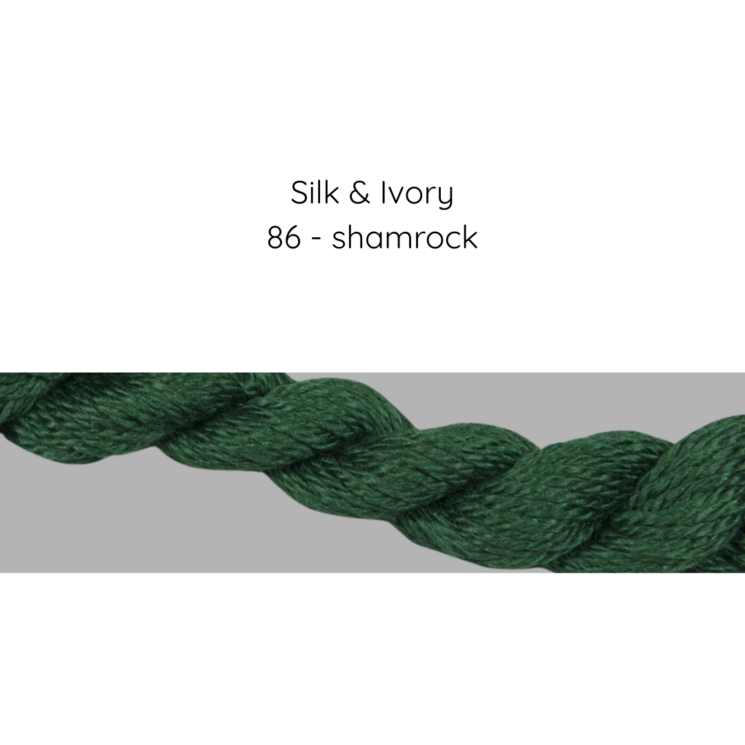 Green yarn with 'Silk & Ivory 86 - shamrock' text on a gray background