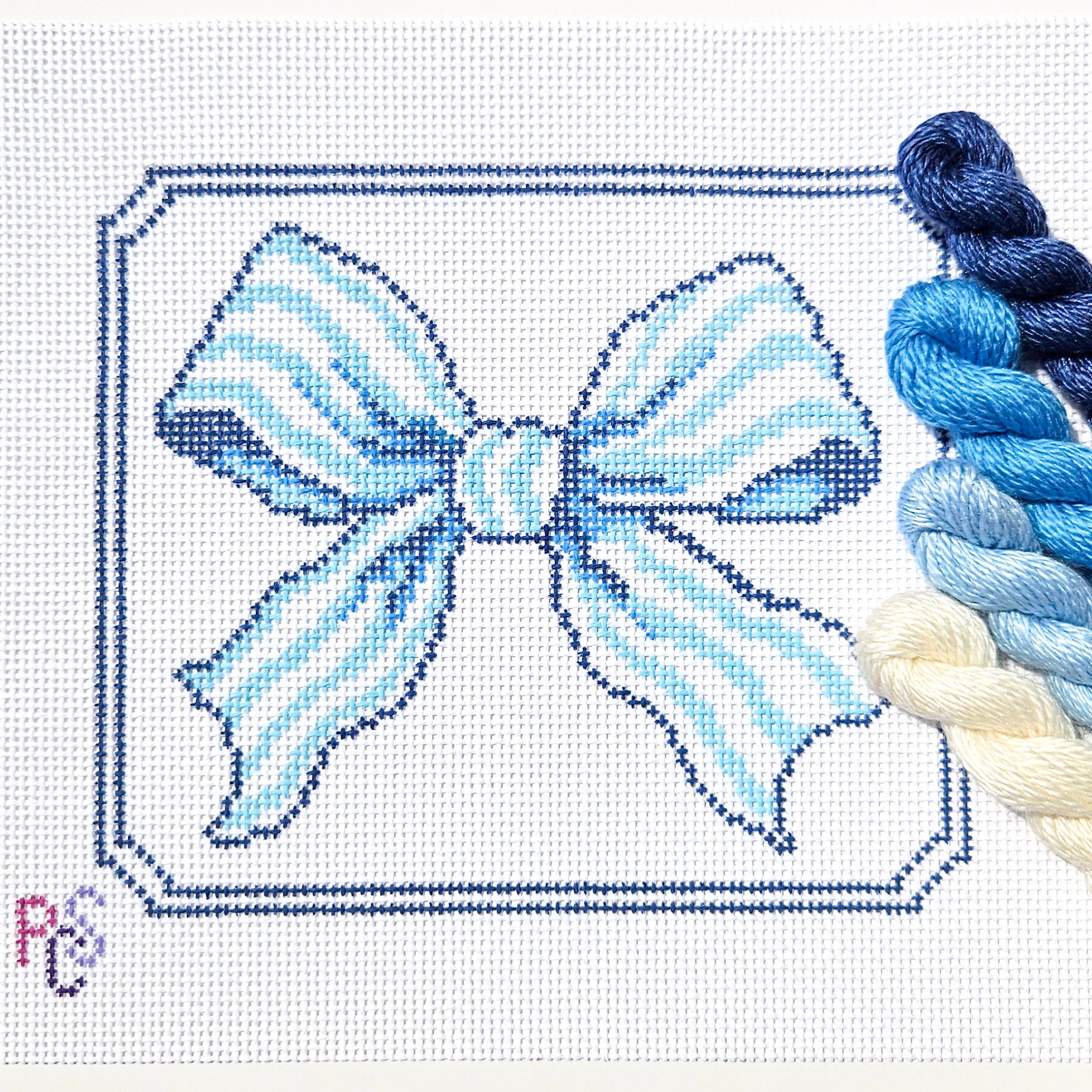 Hand-painted Blue Ribbon Bow Needlepoint Kit on 13 Count Zweigart Mono Deluxe Canvas featuring an elegant soft blue bow with a classic double-line border Silk and Ivory thread